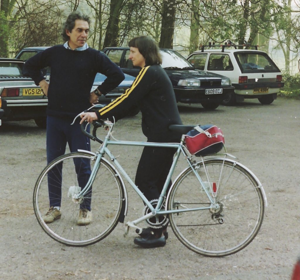 Vintage photo of man and woman with a bike